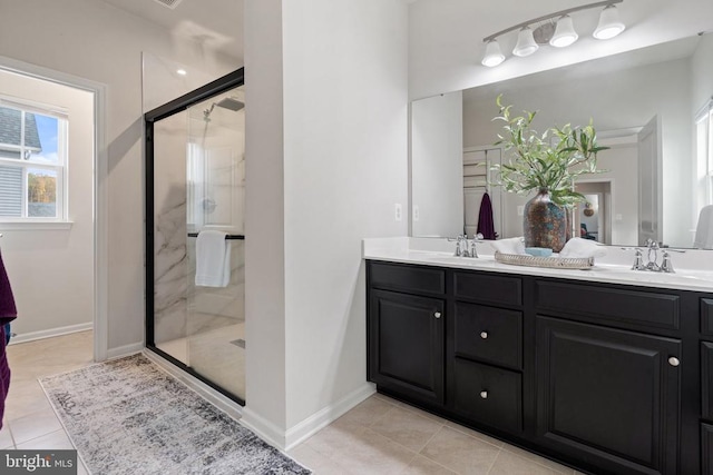 bathroom featuring vanity, tile patterned floors, and a shower with shower door