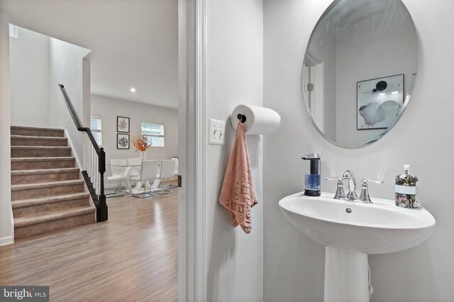 bathroom with sink and hardwood / wood-style floors