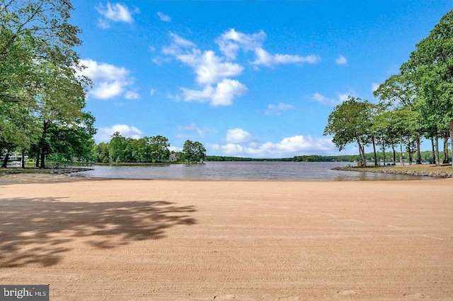 view of community with a water view