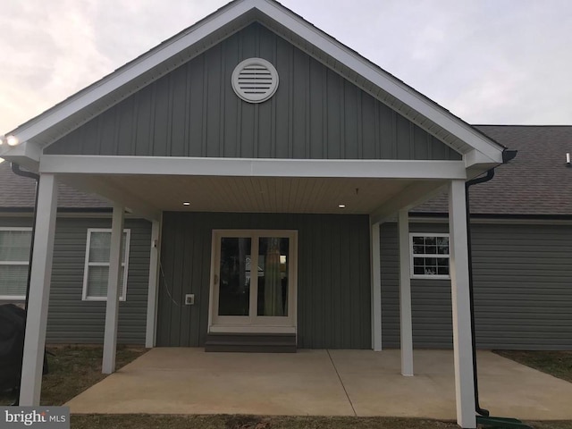 entrance to property featuring a carport