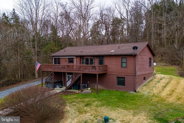 back of property featuring a yard, a deck, stairs, and central air condition unit