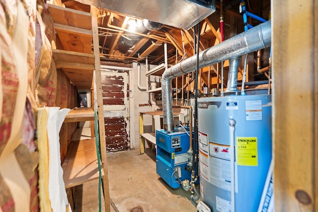 utility room featuring water heater