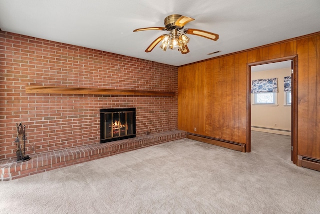 unfurnished living room featuring a fireplace, carpet, visible vents, and baseboard heating