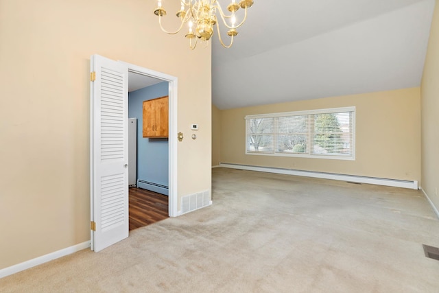 interior space featuring a baseboard heating unit, carpet floors, a notable chandelier, and visible vents