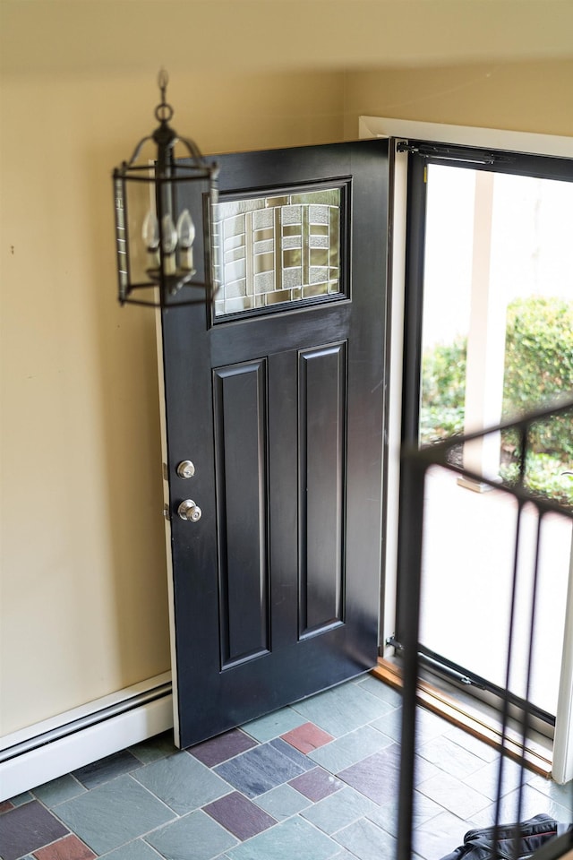 doorway to property featuring a baseboard radiator