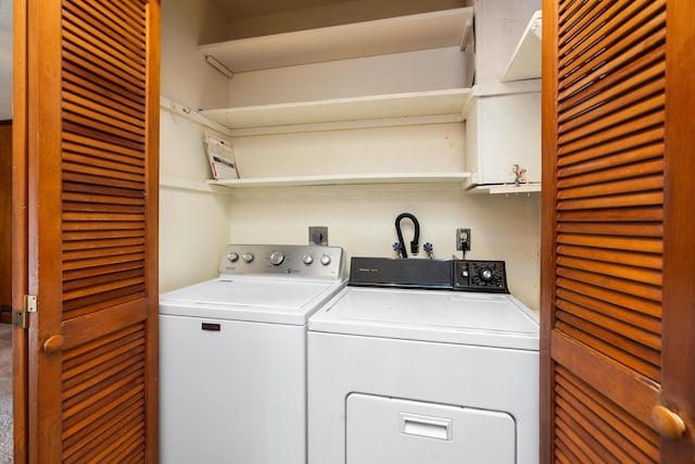 laundry area featuring washing machine and dryer and laundry area