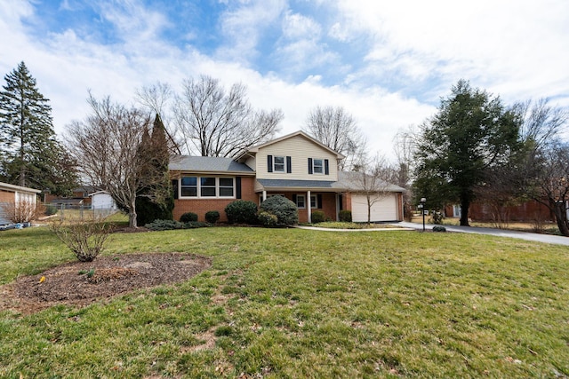 tri-level home featuring driveway, brick siding, an attached garage, and a front lawn