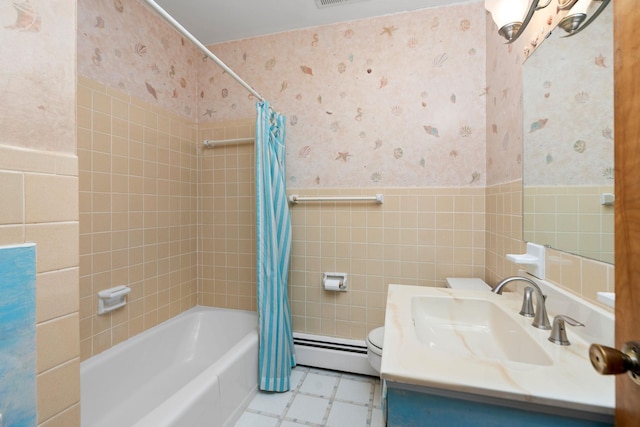 bathroom featuring wallpapered walls, toilet, baseboard heating, and wainscoting