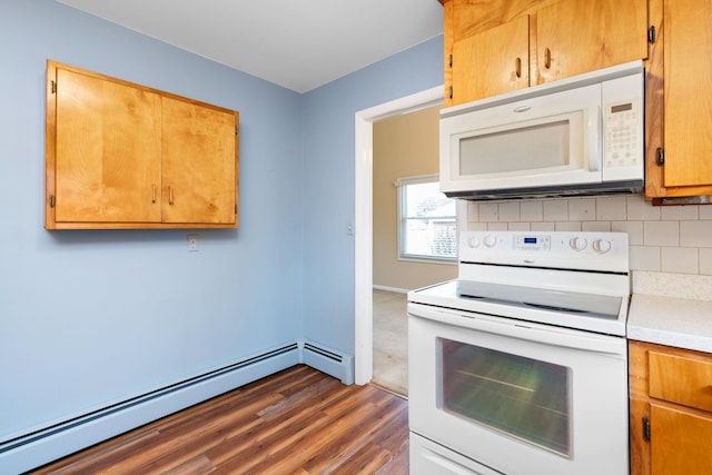 kitchen featuring decorative backsplash, dark wood-style floors, white appliances, light countertops, and a baseboard radiator