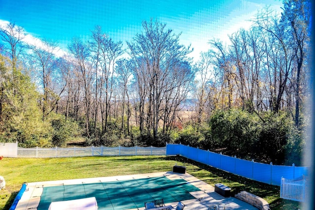 view of pool with a lawn, a patio area, a fenced backyard, and a fenced in pool