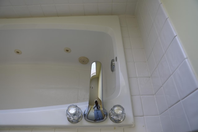 interior details featuring a whirlpool tub