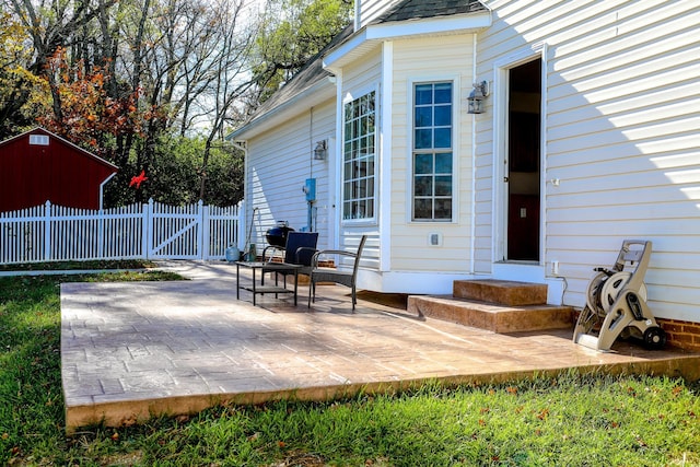 view of patio featuring entry steps and fence