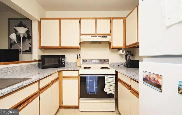 kitchen with white cabinetry, sink, and white range with electric cooktop