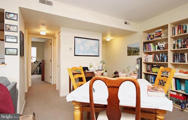 view of carpeted dining space