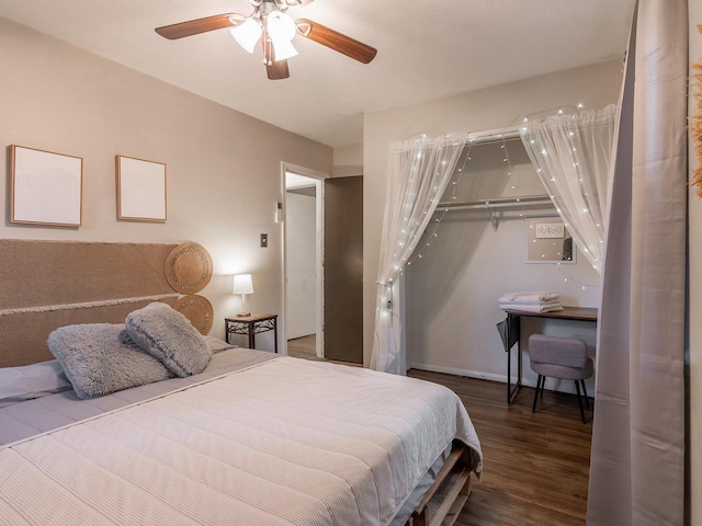 bedroom with ceiling fan, wood-type flooring, and a closet