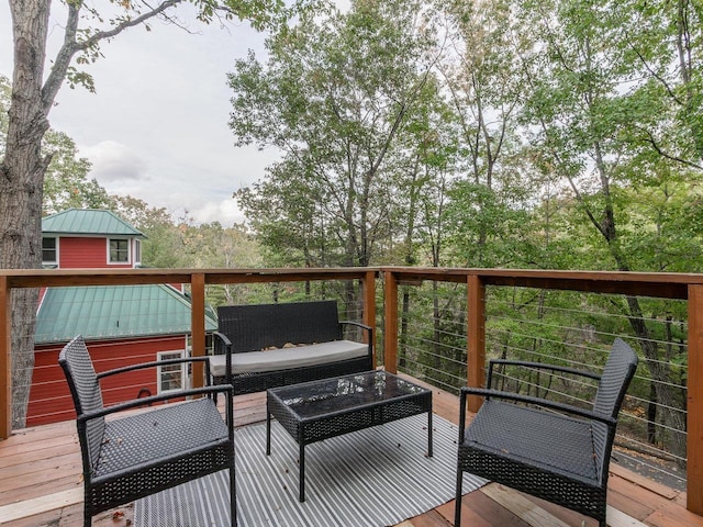 wooden terrace featuring outdoor lounge area