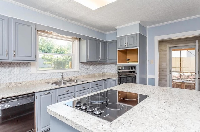 kitchen featuring sink, gray cabinetry, decorative backsplash, and black appliances