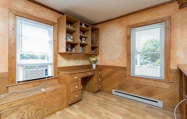 home office with built in desk, cooling unit, ornamental molding, baseboard heating, and light hardwood / wood-style floors