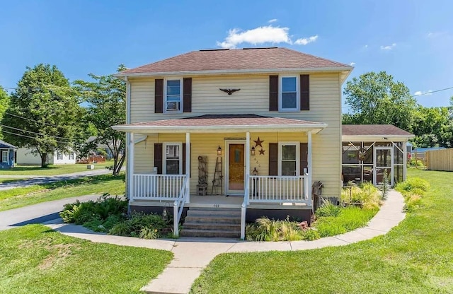 view of front of home with a porch and a front lawn