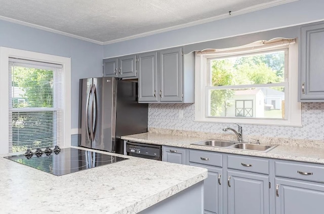 kitchen with a wealth of natural light, gray cabinets, sink, and black appliances