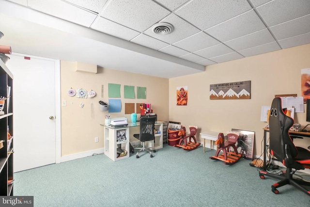 carpeted home office featuring visible vents, baseboards, and a drop ceiling