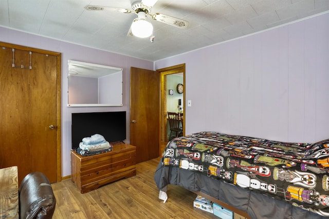 bedroom featuring ceiling fan and wood finished floors