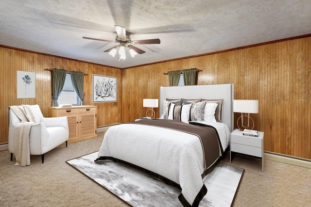 bedroom featuring a textured ceiling, wooden walls, ornamental molding, baseboard heating, and carpet