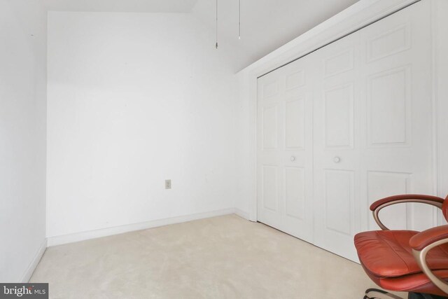 unfurnished room featuring light carpet