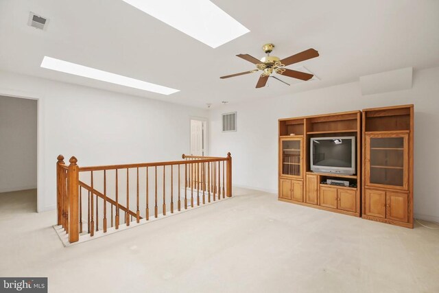 carpeted living room featuring ceiling fan