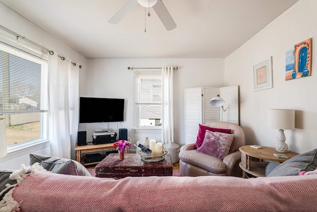 living area featuring a ceiling fan