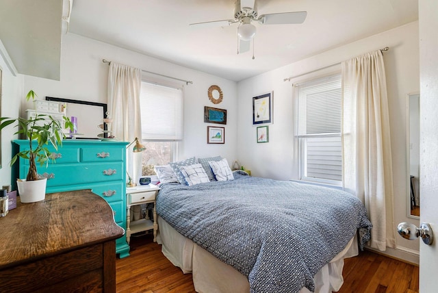 bedroom with wood finished floors and a ceiling fan