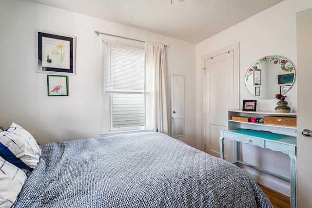 bedroom with wood finished floors