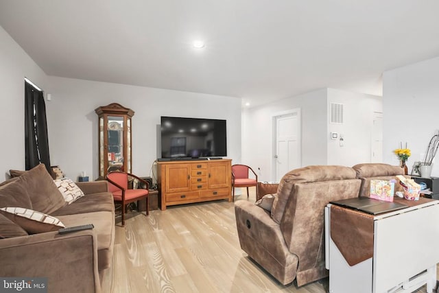 living room with light hardwood / wood-style floors