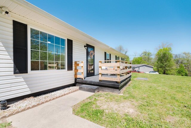 property entrance with a yard