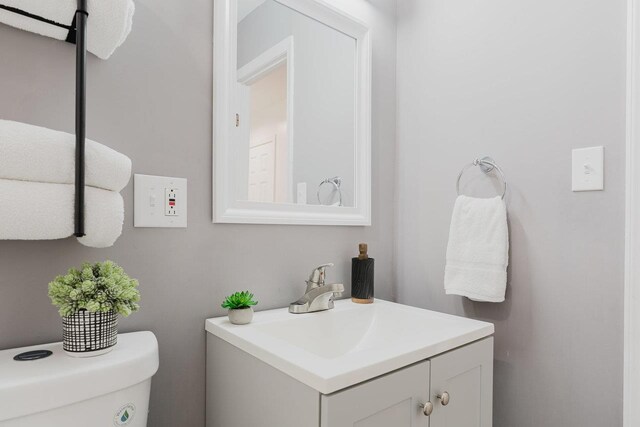 bathroom featuring vanity and toilet