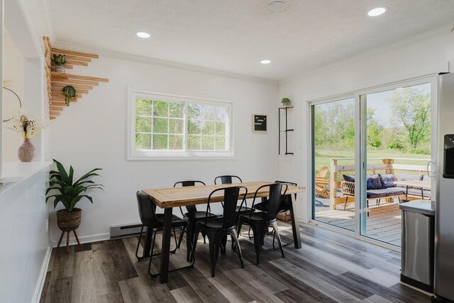 dining room featuring recessed lighting, ornamental molding, and dark wood finished floors