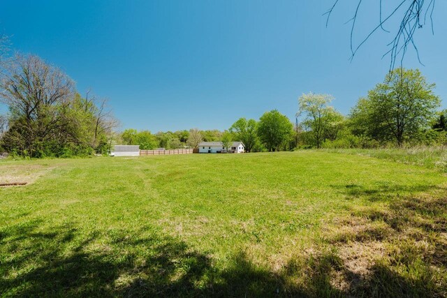 view of yard with a rural view