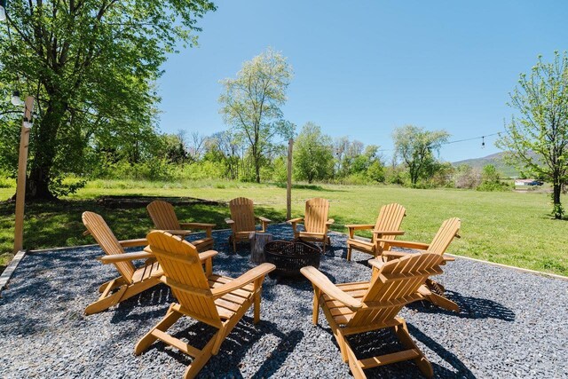 view of patio / terrace featuring an outdoor fire pit