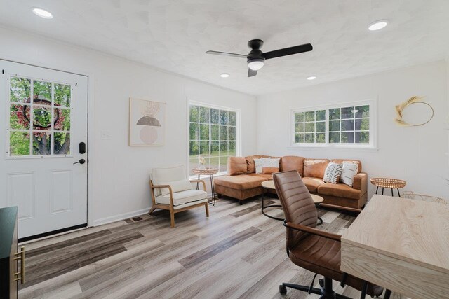 living area featuring ceiling fan, recessed lighting, and light wood-style flooring