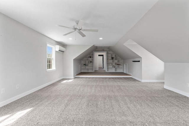 additional living space featuring built in features, carpet, a ceiling fan, lofted ceiling, and a wall mounted AC