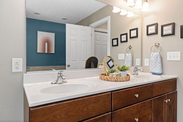 bathroom with double vanity and a sink