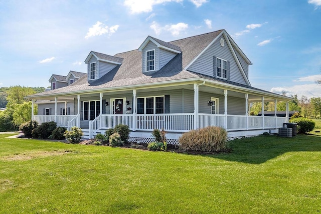 view of front of home with a shingled roof, central AC, covered porch, and a front yard