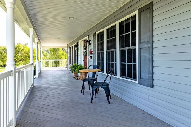 wooden terrace with a porch