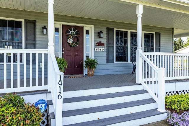 doorway to property featuring a porch