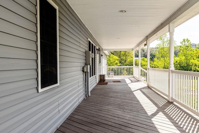 wooden terrace with a porch
