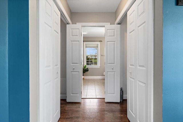 hallway with dark wood-style flooring