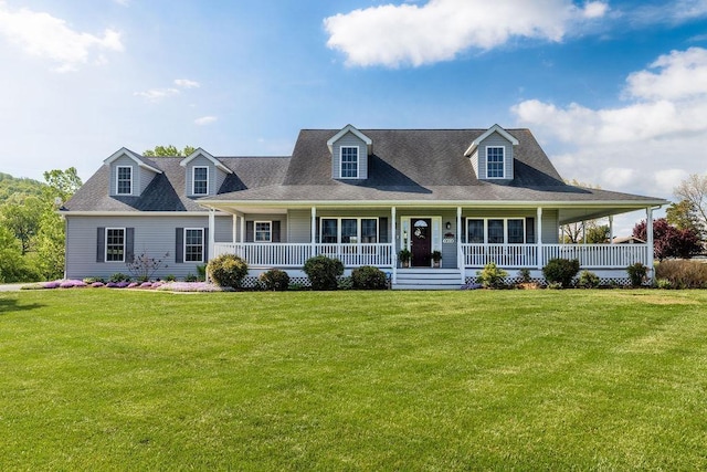 cape cod house with covered porch and a front yard