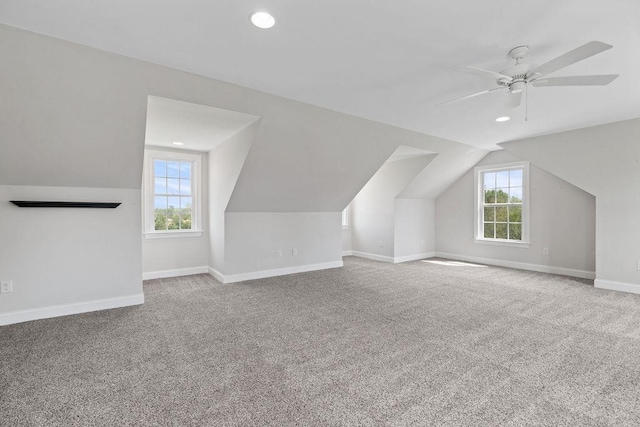 additional living space featuring a ceiling fan, vaulted ceiling, baseboards, carpet, and recessed lighting