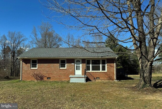 ranch-style home with a storage shed