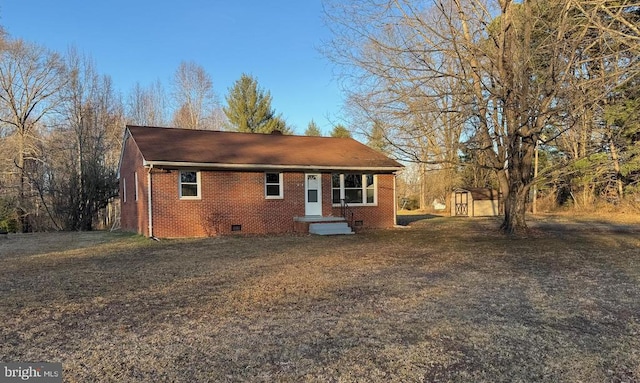 view of front of home with a shed